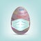 Easter Egg in surgical mask. Colourful 3D egg in protective medical mask vector isolated on blue background. Stop virus COVID-19