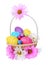 Easter eggs in beautiful basket with chamomile flowers isolated