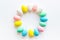 Easter eggs circle frame on white desk top-down copy space mockup