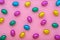 Easter eggs in colorful foil over pink, holiday