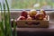 Easter eggs are coloured by the ancient onion husk method with various natural patterns lying by window in sunshine on beige