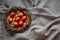 Easter Eggs Decorated with Natural Fresh Leaves and Boiled in Onions Peels on gray linen tablecloth in a wreath. Happy Easter conc