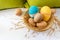 Easter eggs decoration, eggs in the nest, springtime rural composition. selective focus