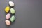 Easter eggs, decorative abstract colorful eggs. Over grey background, top view