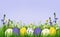 Easter eggs, grass and wild flowers background