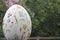 Easter Eggs Hunting event in London city center - giant white egg with spring flowers