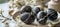 Easter eggs with intricate black and white marble patterns on white plate with copy space