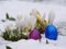 Easter eggs laying snow flowers