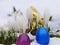 Easter eggs laying snow flowers