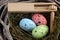 Easter eggs in nest with traditional easter instrument - rattle - clapper