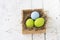 Easter eggs in the nest on wooden background