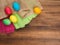 Easter eggs on old brown wood background with borlap and green paper. Top view, horizontal. Mock up for your greetings