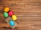 Easter eggs on old brown wood background. Top view, horizontal. Mock up for your greetings card, poster or other design