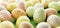 Easter eggs painted in pastel colors stripes on white