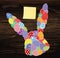 Easter eggs with a pattern in the shape of an rabbit. Empty Yellow sheet of paper for notes. Sticker. Greeting card for the holid