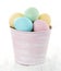 Easter eggs in pink decorative bucket