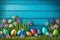 Easter eggs on turf grass and blue wooden wall with spring vivid flowers