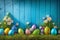 Easter eggs on turf grass and blue wooden wall with spring vivid flowers