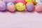 Easter eggs of various colors at the top of the table. Festive background with copy space