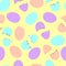 Easter eggs whole and chopped in half on a yellow background. Seamless Easter pattern