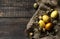 Easter eggs on wooden background. Gold handmade easter eggs in a basket.