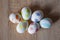 Easter eggs on wooden table. Happy Easter holiday celebration. Easter bunny hunt. Spring holiday at Sunday. Eastertide and