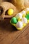 Easter eggs in yellow carton with jute decoration