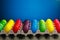 Easter festive multicolor eggs carton  blue background