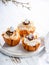 Easter Filo Pastry Baskets with meringue and melted chocolate and chocolate eggs on a white Background. Space for your text