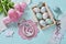 Easter flat lay with bunch of pink tulips and eggs in wooden box