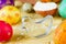 Easter food concept: preparation of holiday cookies shaped chick and colorful eggs on raw dough background