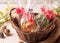 Easter green and yellow wrapped cookies in a brown wicker basket near