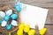 Easter greeting card with blue and white eggs and yellow tulips