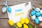 Easter greeting card with blue and white eggs and yellow tulips