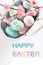 Easter greeting card with text and colorful eggs in metal basket