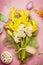 Easter greeting flowers bunch with Narcissus , egg, cake and blank tag