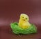 Easter greeting image. Chicken in green grass