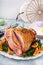 Easter ham stuffed with orange slices, spiral sliced glazed ham