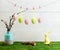 Easter hanging eggs over wooden background