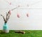 Easter hanging eggs over wooden background