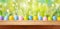 Easter holiday background with empty wooden table and Easter eggs over green grass meadow.  Spring mock up for design and product