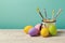 Easter holiday background with handmade painted eggs and brushes