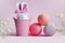 Easter holiday concept with cute handmade eggs  bucket and bunny ears