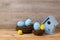 Easter holiday concept with handmade eggs decoration, bird house and nest