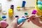 Easter holiday craft at home. Little child\\\'s hands painting colored eggs