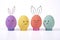 Easter holiday creative with handmade eggs colored. Group cute bunny a Various emotions