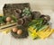 Easter holiday. Decorative Easter arrangement with flowers, plants, pots and eggs. Colors are brown, yellow, green, beige, olive a