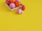 Easter holiday. Easter eggs in a tray for eggs. Eggs on a stand. Yellow background.