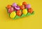 Easter holiday. Easter eggs in a tray for eggs. Eggs on a stand. Yellow background.