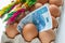 Easter holidays and the price of eggs in Poland. The concept of rising inflation, Traditional festive Easter palms, a tray of eggs